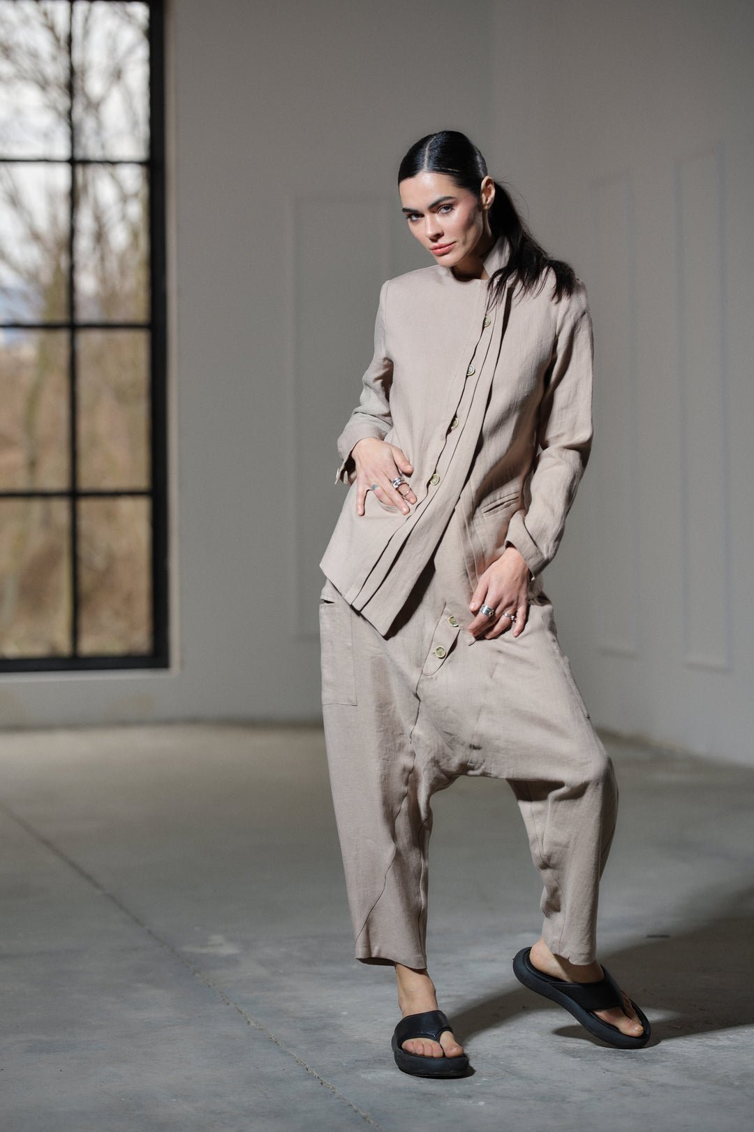 Avant garde linen blazer featuring asymmetrical button closure